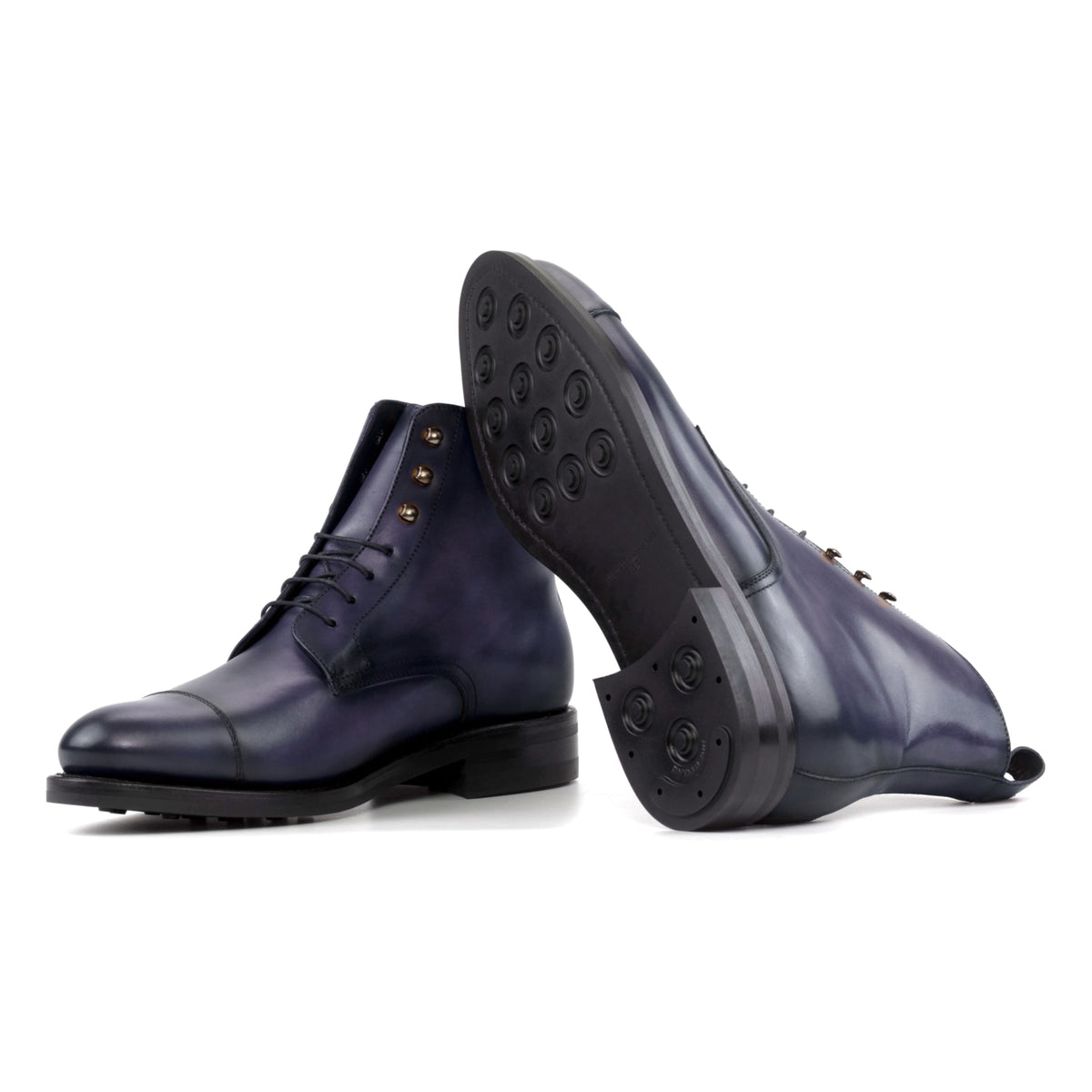 Bottines Bout Droit en cuir teinté main bleu pétrole : une bottine couchée montre la semelle