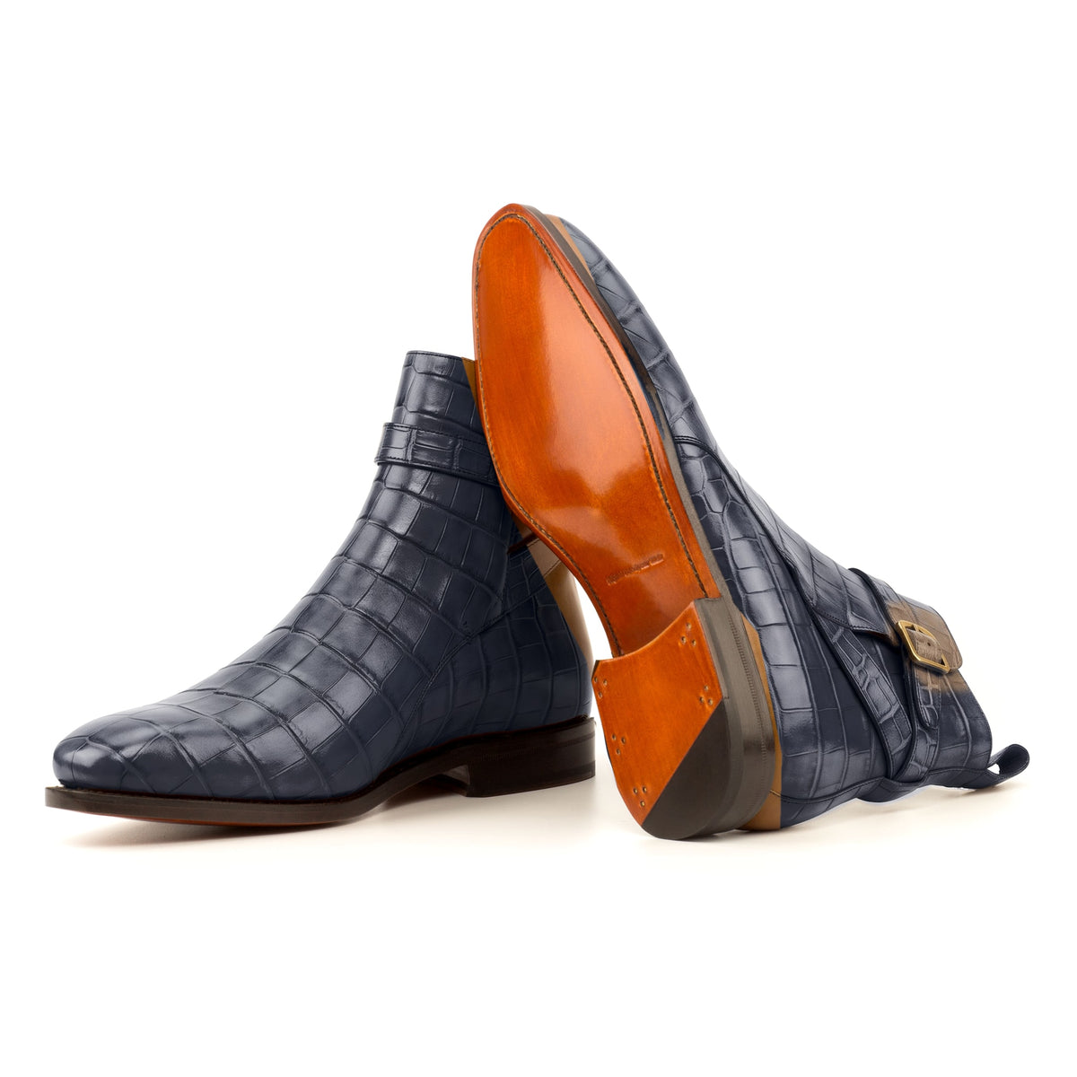 Bottines Jodhpur en cuir croco bleu pétrole : une bottine couchée montre la semelle