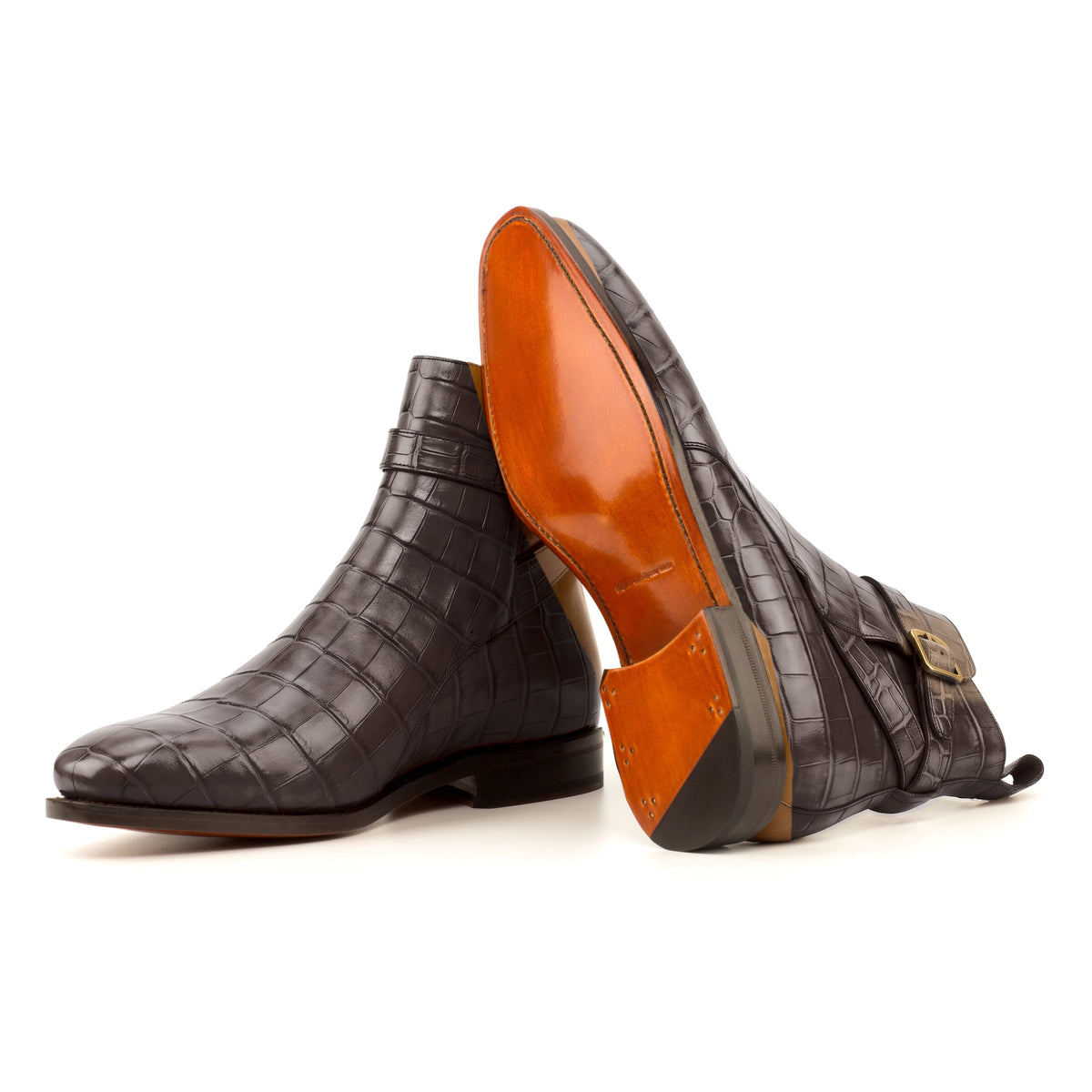 Bottines Jodhpur en cuir croco marron foncé : une bottine couchée montre la semelle