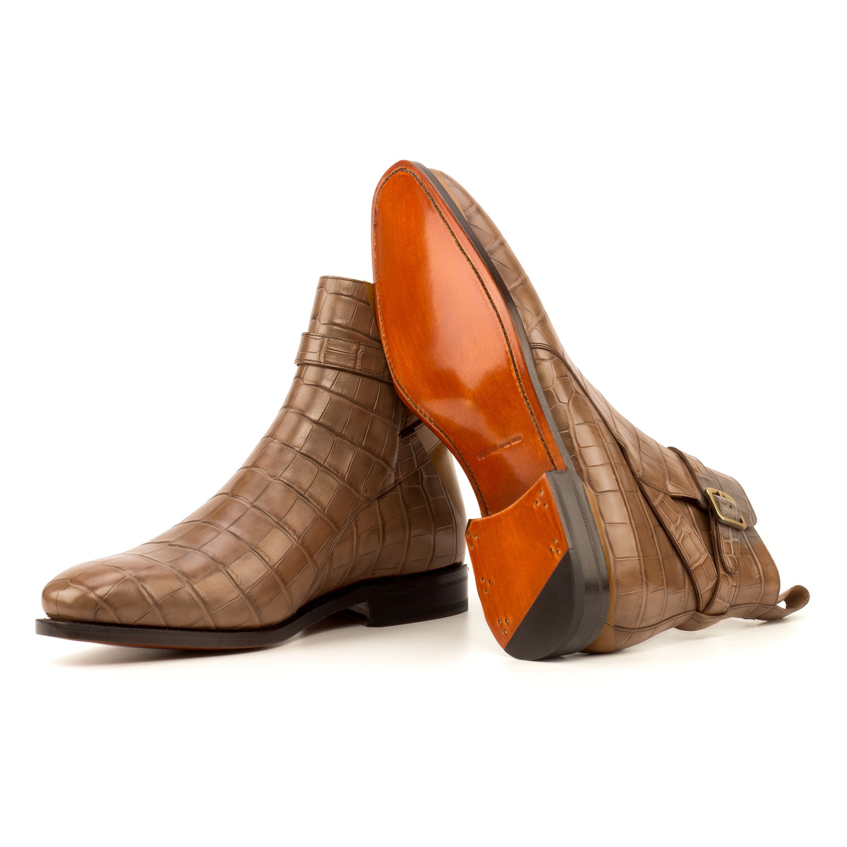 Bottines Jodhpur en cuir croco marron moyen : une bottine couchée montre la semelle