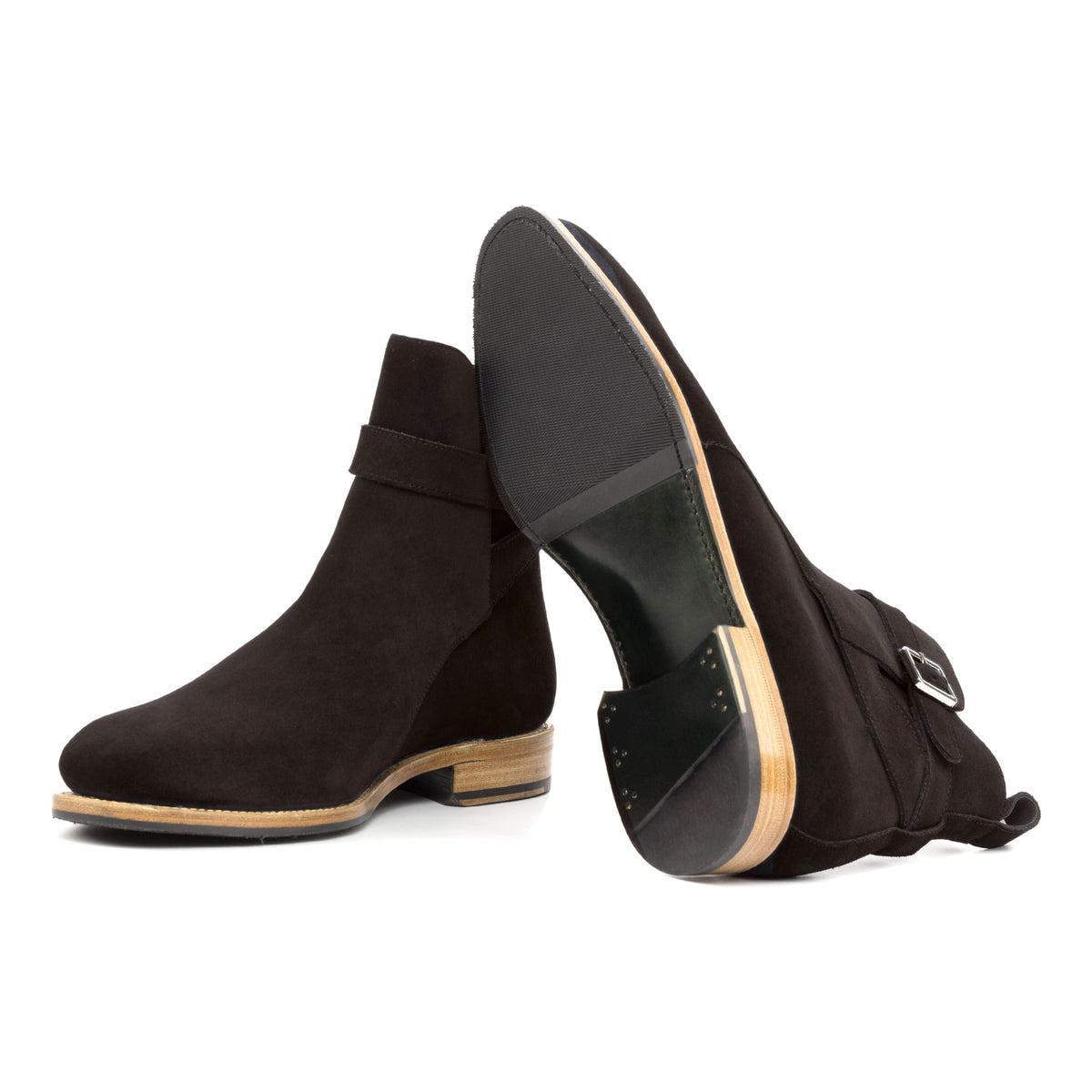 Bottines Jodhpur en daim marron foncé : une bottine couchée montre la semelle