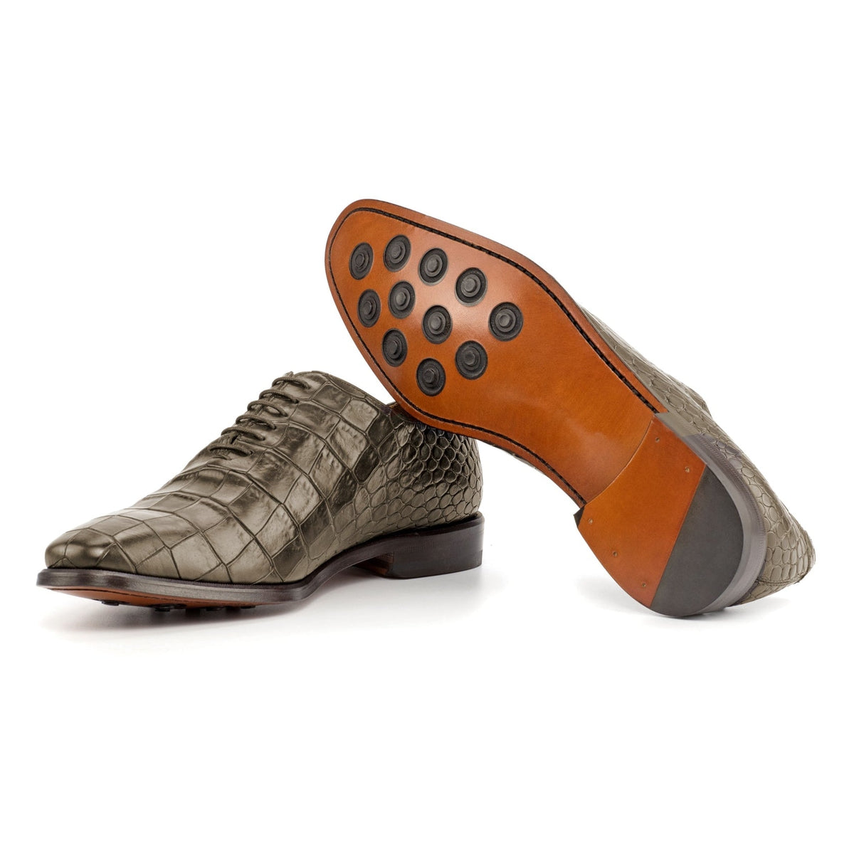 One Cut en cuir façon croco vert olive : une chaussure debout, l’autre couchée montre sa semelle