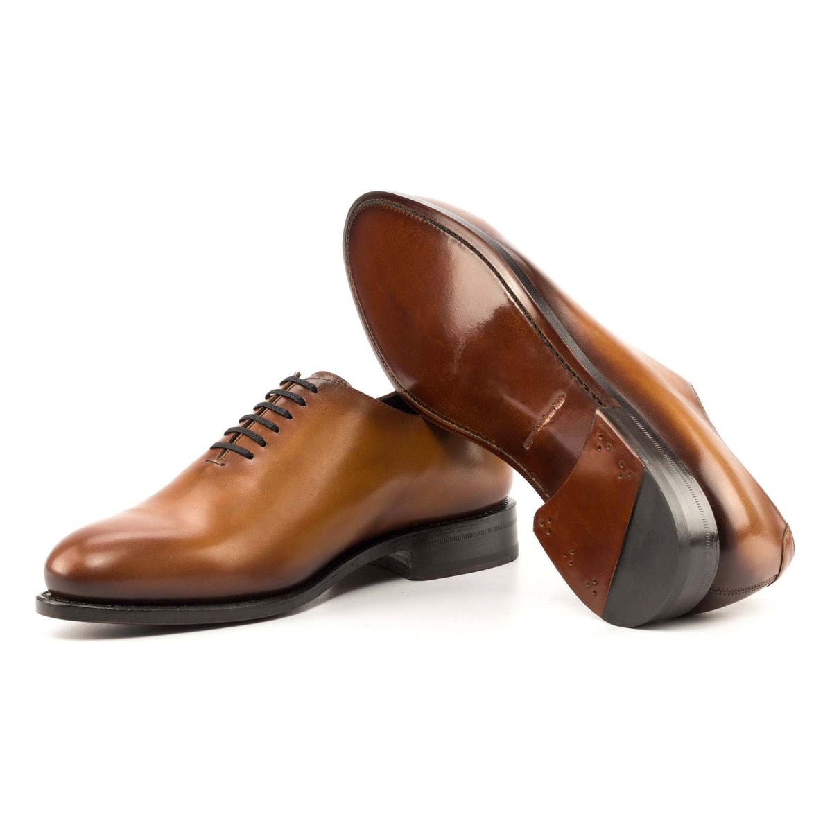One Cut en cuir marron clair, semelle cuir : une chaussure debout, l’autre couchée qui montre sa semelle